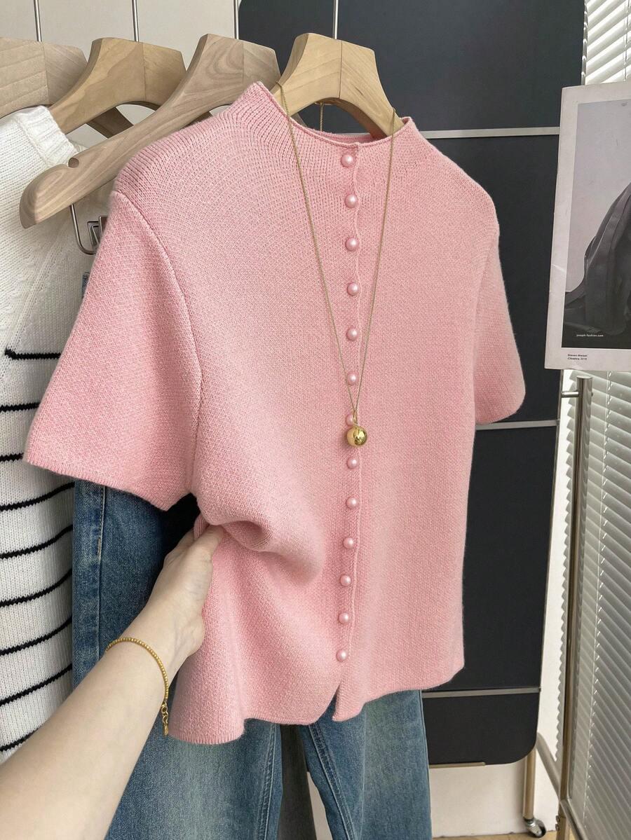 różowy dzianinowy sweter