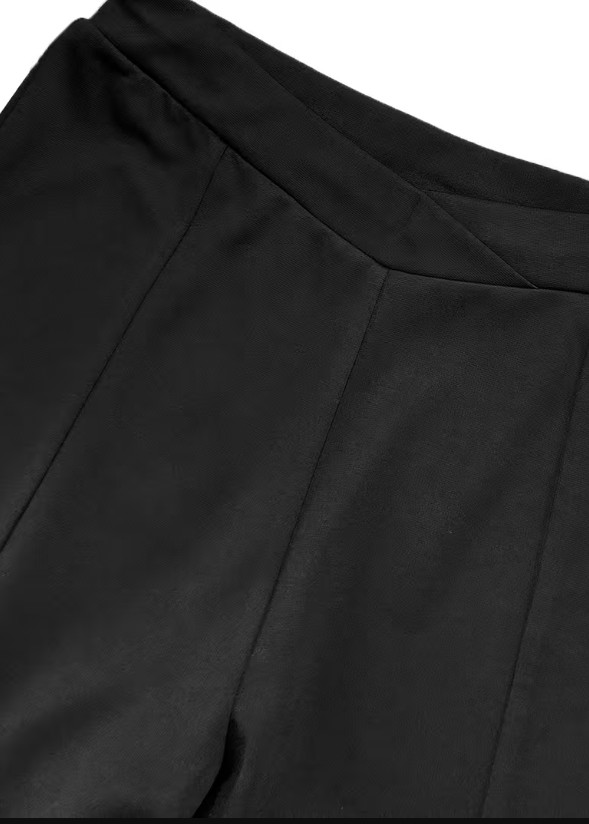czarne spodnie capri z gumką w pasie asymetria rozcięcia
