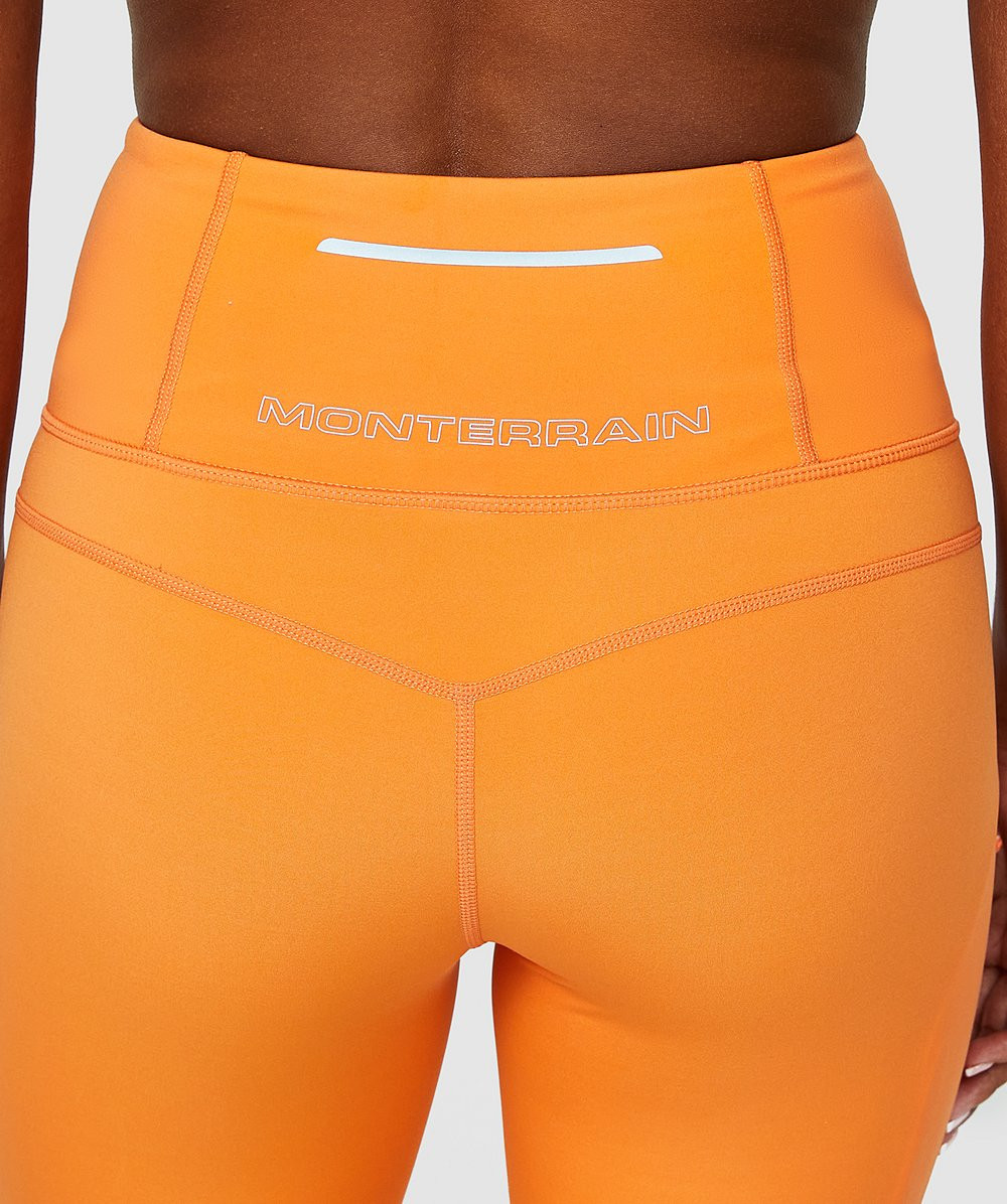 pomarańczowe legginsy Altitude wstawka siateczka logo