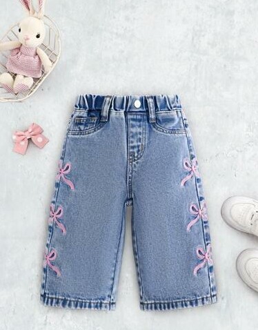 niebieskie spodnie jeans kokardy 