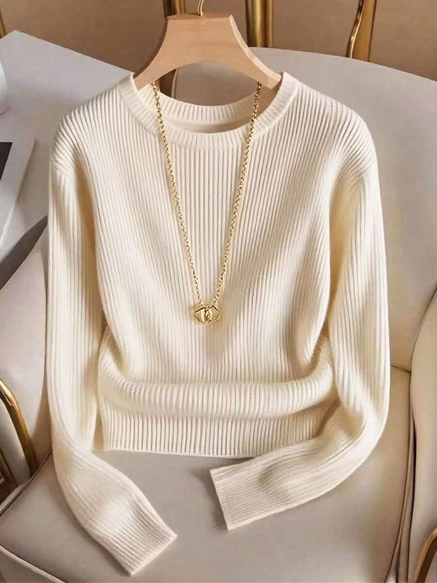 beżowy sweter prążki