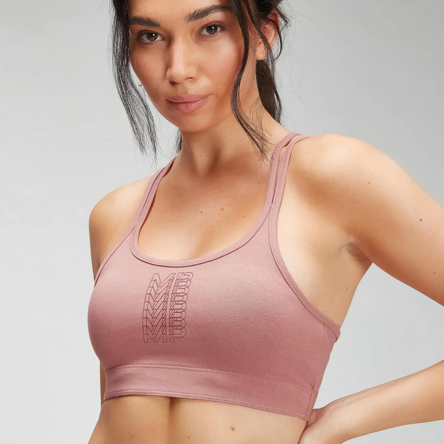 różowy crop top biustonosz sportowy logo cross back