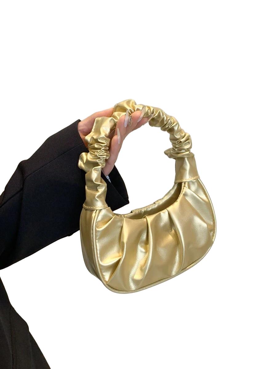 złota torebka marszczenia