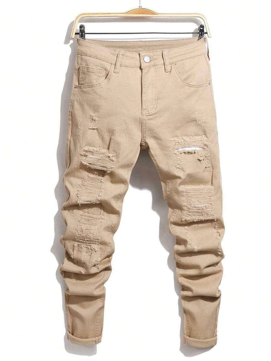 BEŻOWE SPODNIE JEANS PRZETARCIA