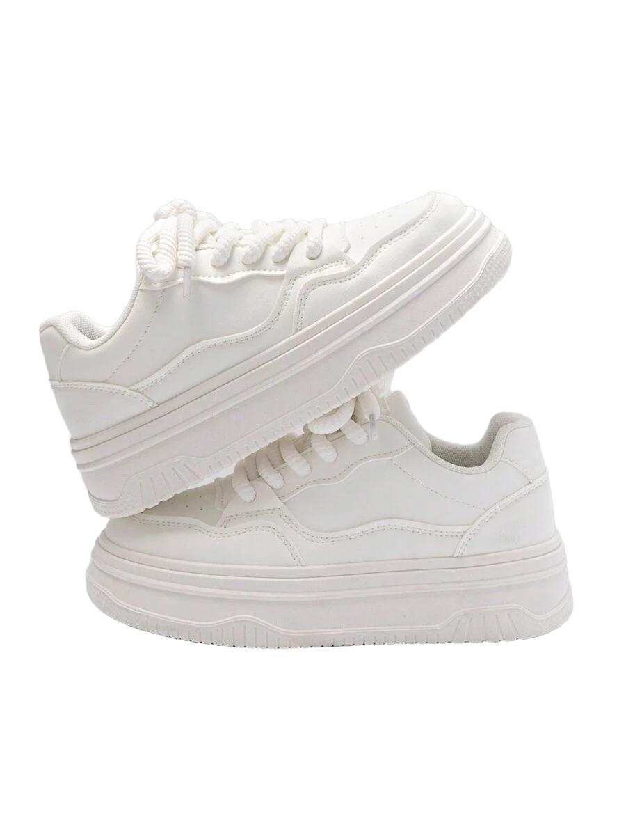 białe sznurowane buty sportowe