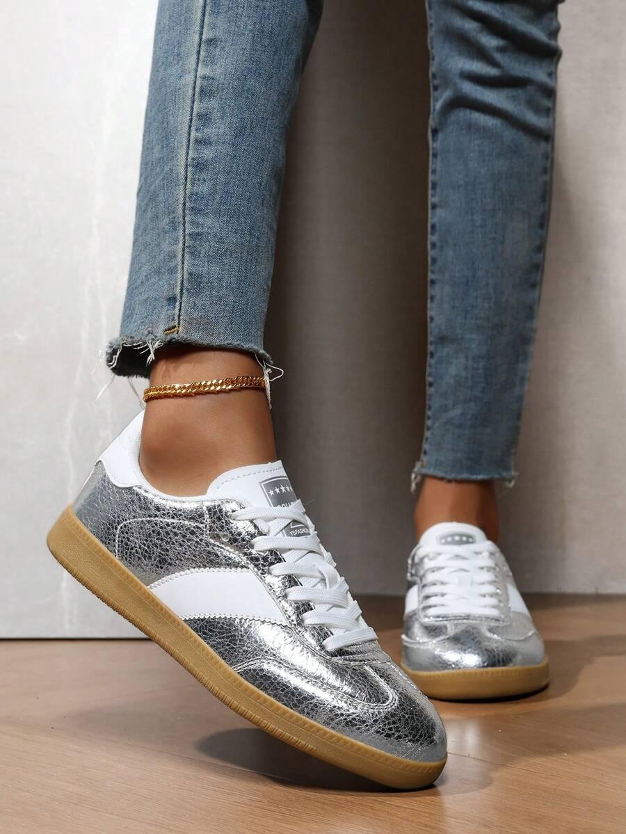 srebrne sznurowane buty sportowe 