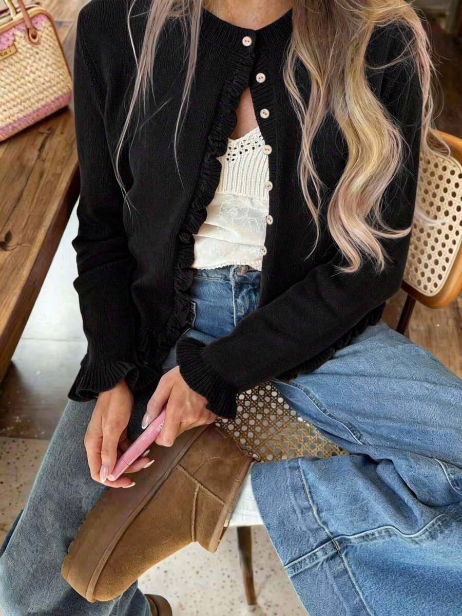 czarny sweter guziki