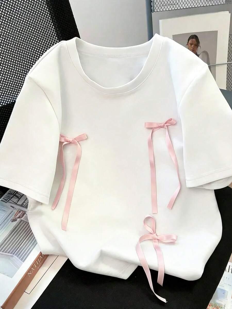 biały t-shirt kokardy