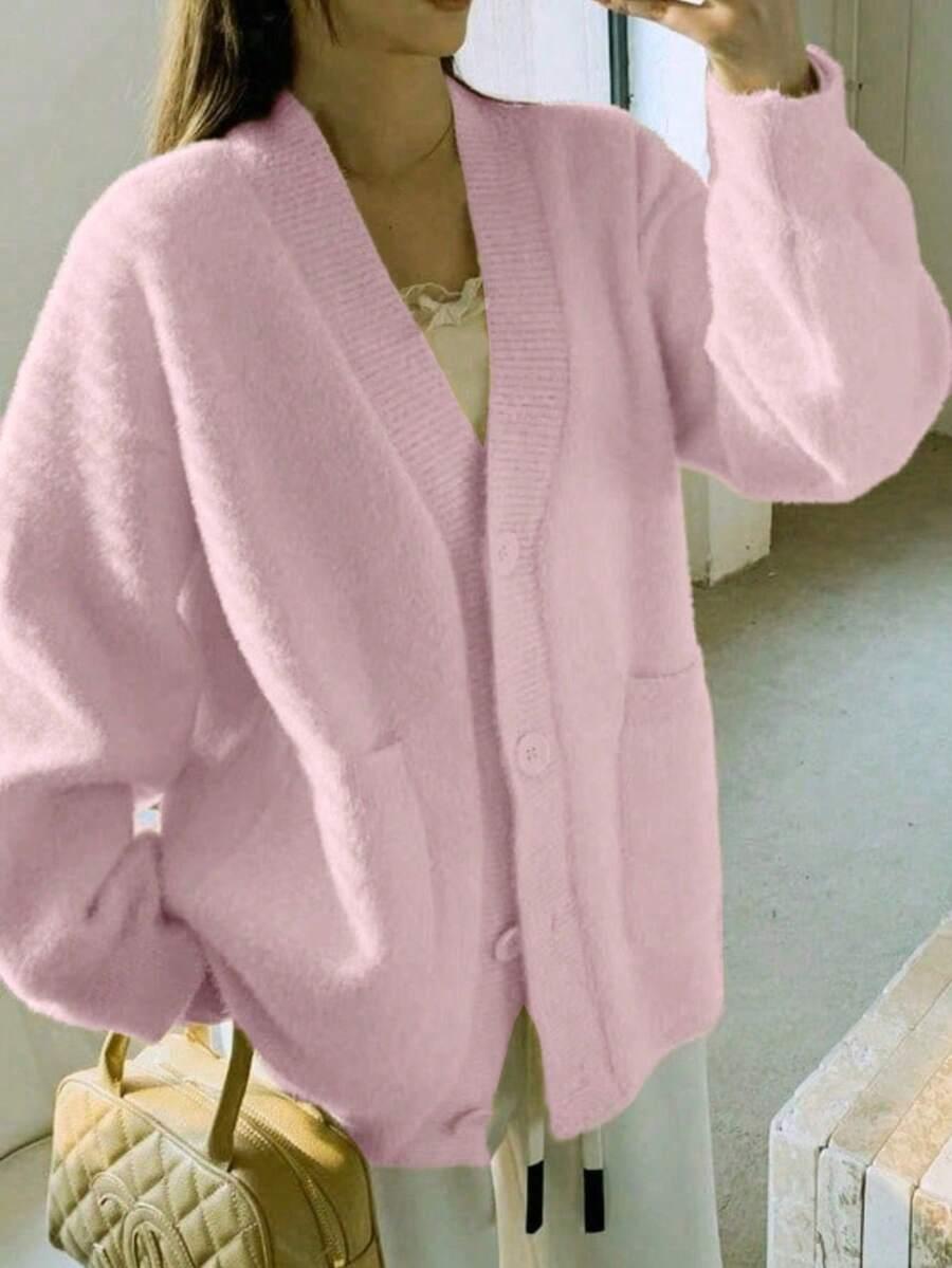 RÓŻOWY SWETER GUZIKI
