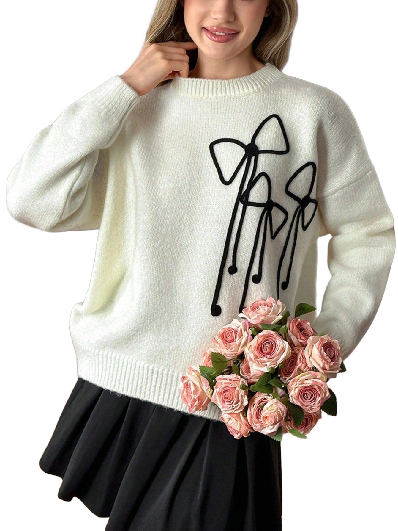 sweter z kokardkami
