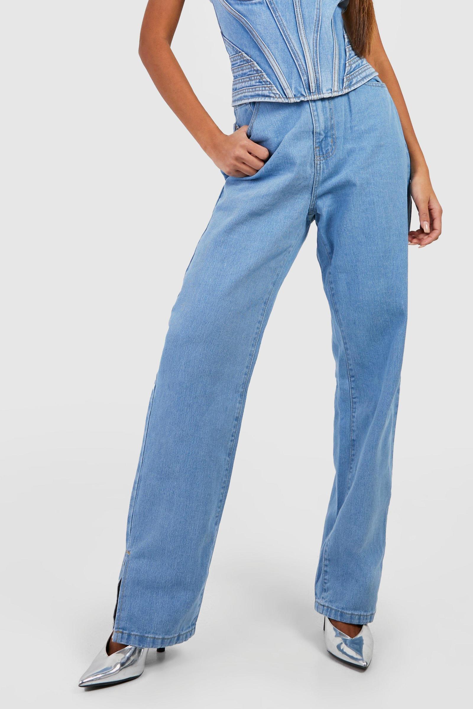 niebieskie spodnie jeans wysoki stan rozcięcie