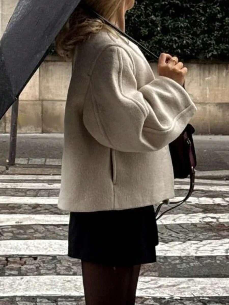 beżowa kurtka guzik