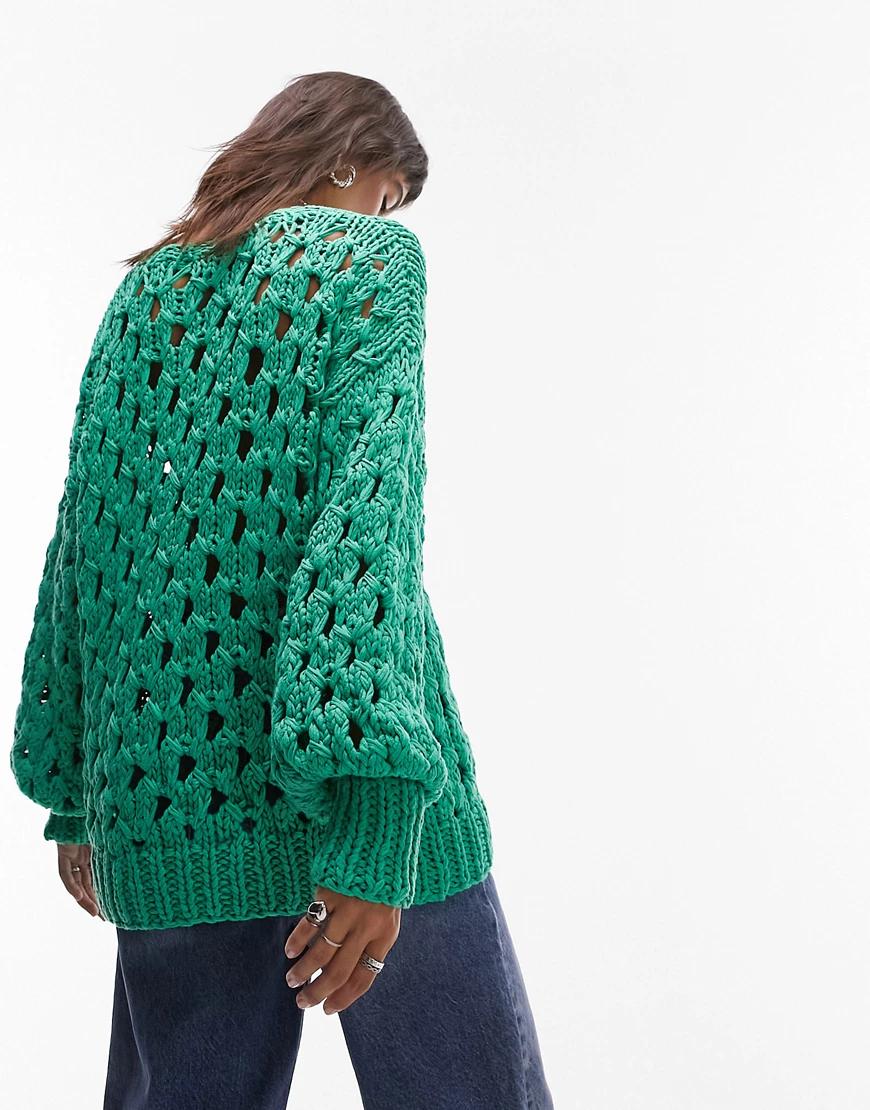 zielony luźny sweter wycięcia tekstura