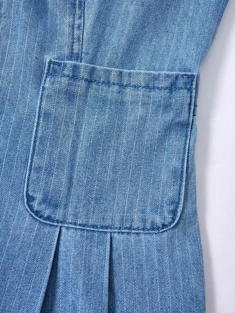 niebieski kombinezon jeans