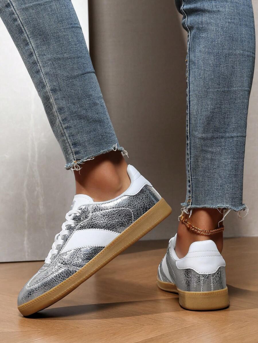 srebrne sznurowane buty sportowe 