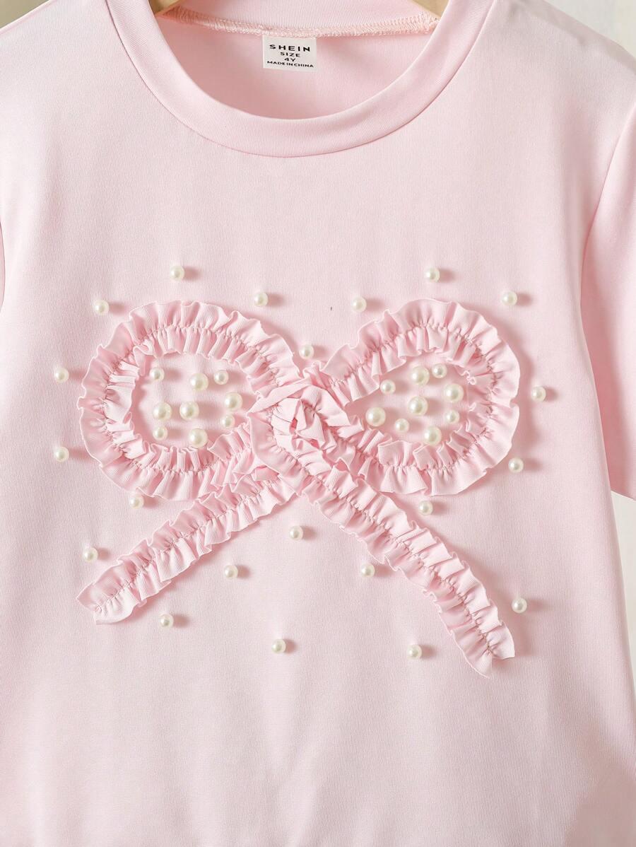 różowy t-shirt kokarda