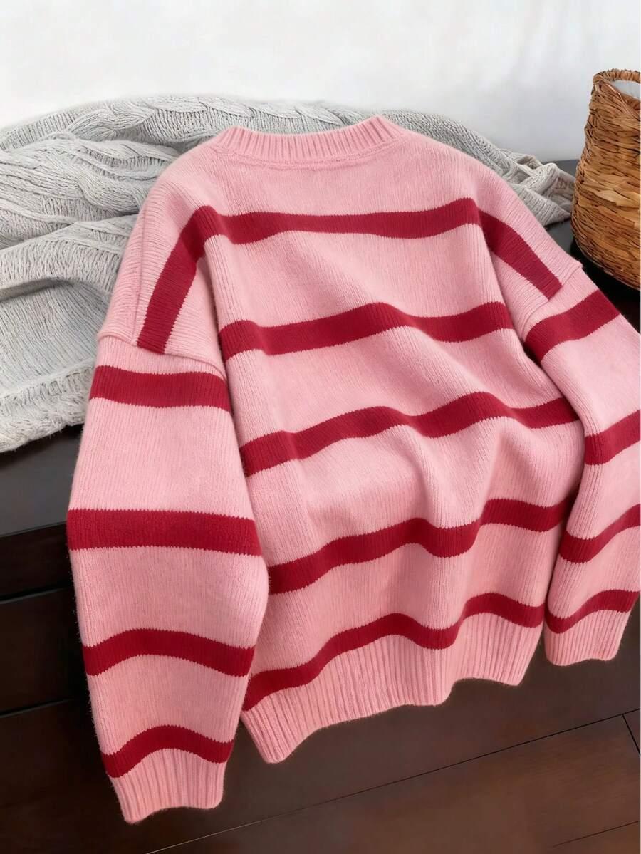 RÓŻOWY SWETER PASKI