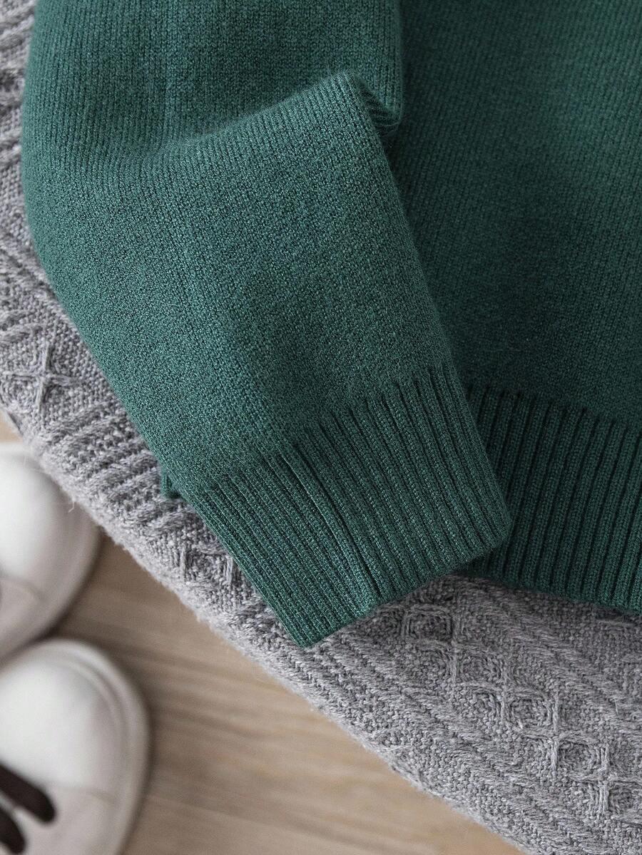 zielony ocieplany sweter