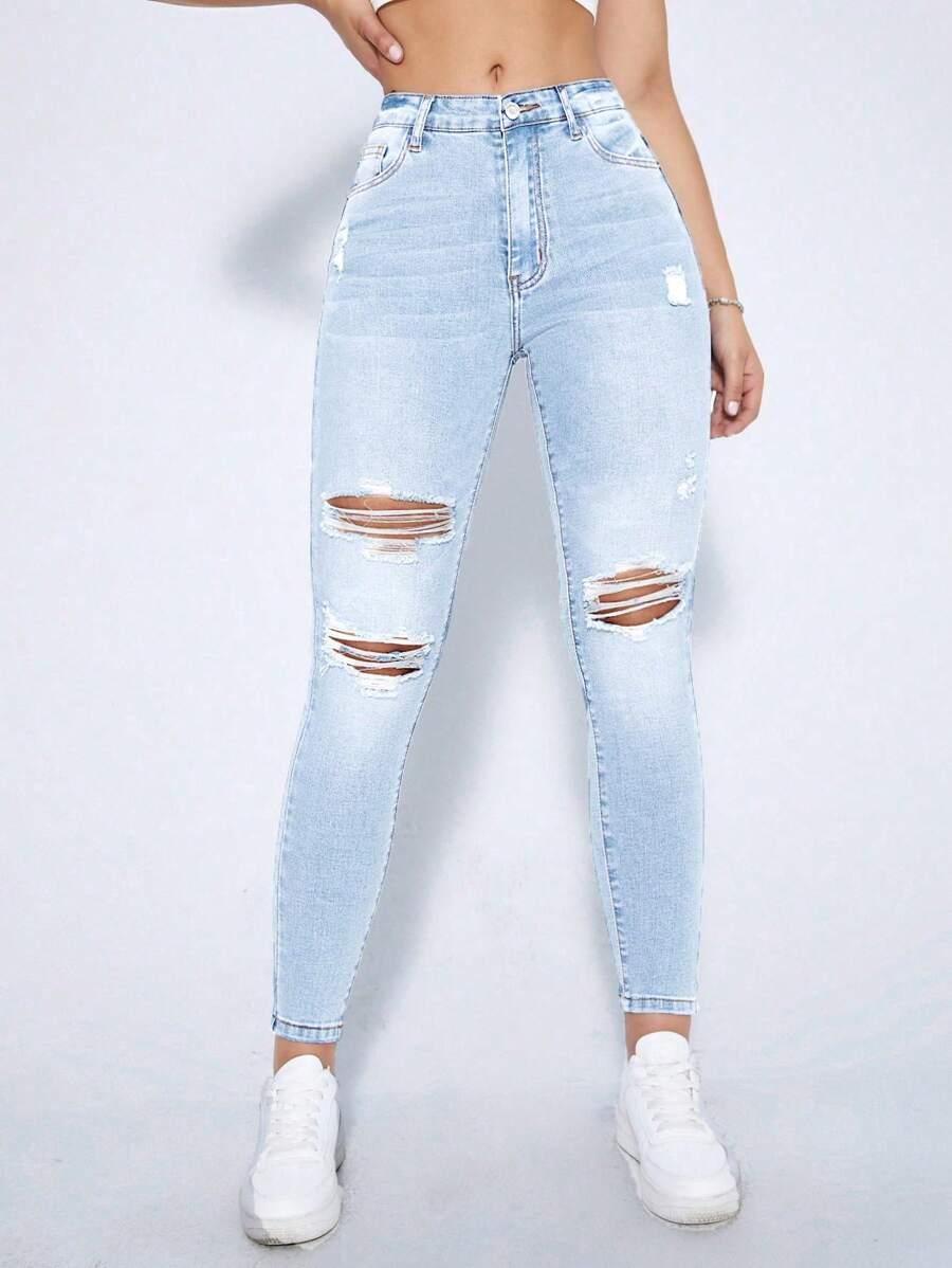 niebieskie spodnie jeans przetarcia