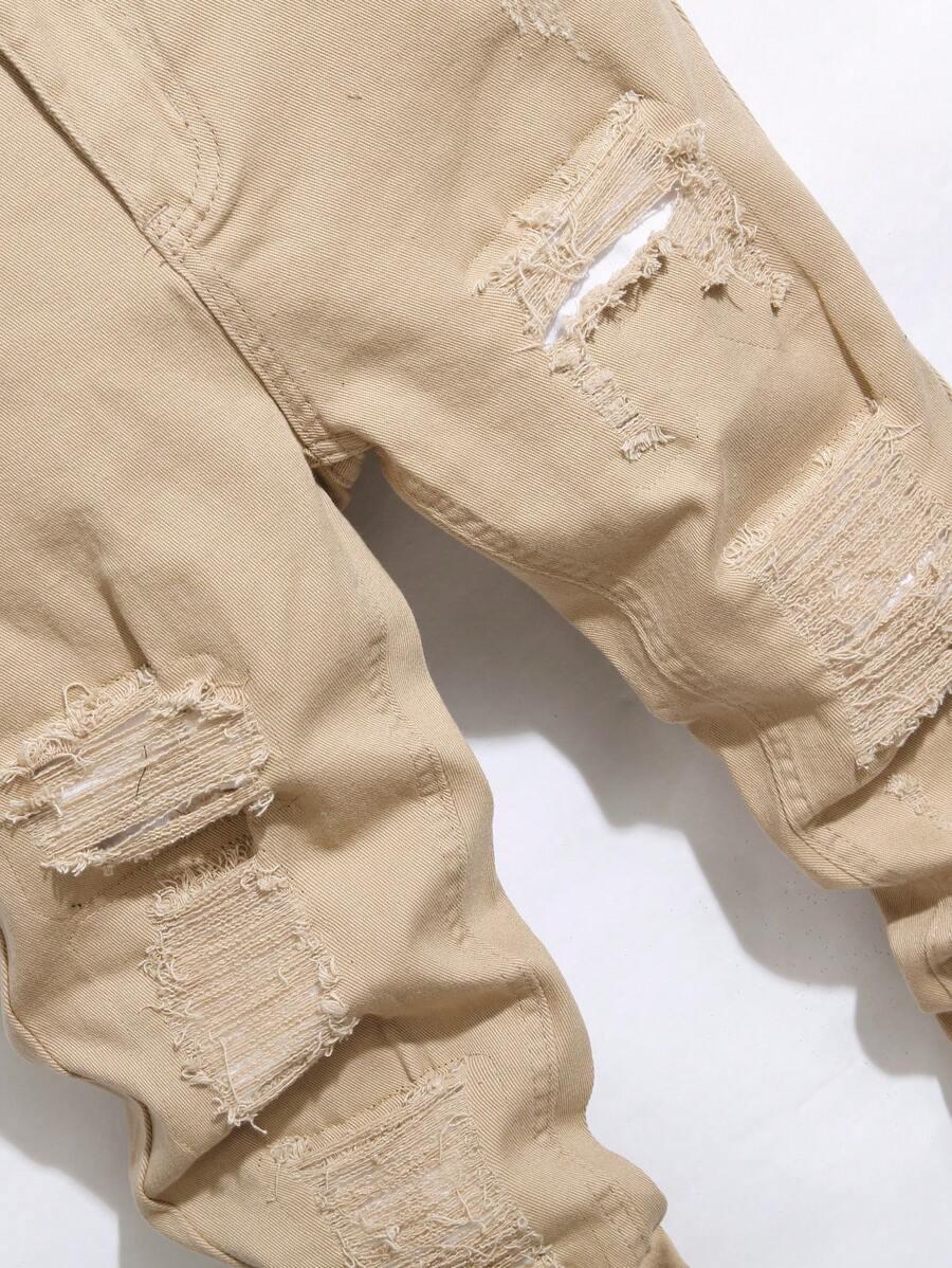 BEŻOWE SPODNIE JEANS PRZETARCIA