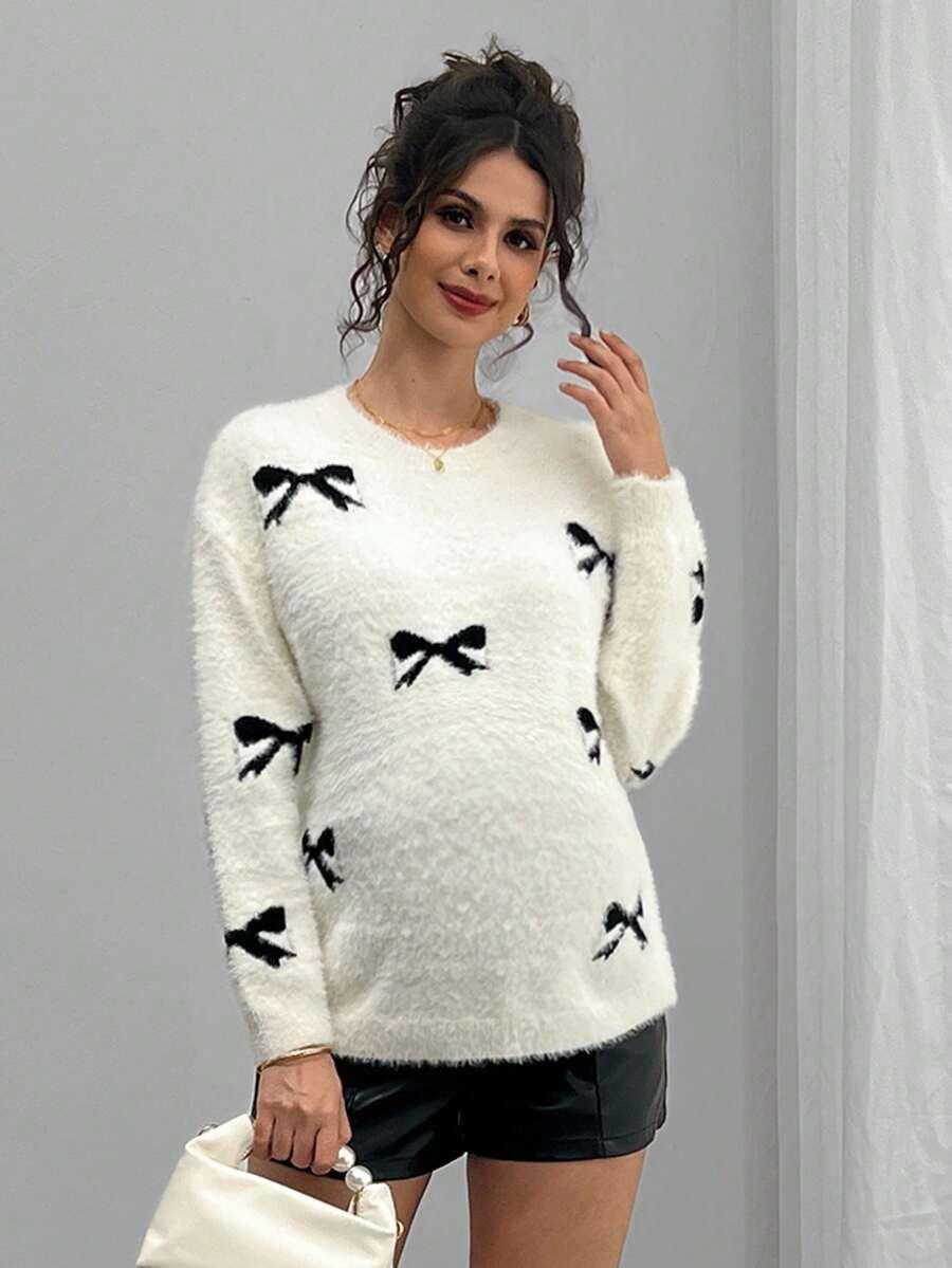 biały sweter ciążowy