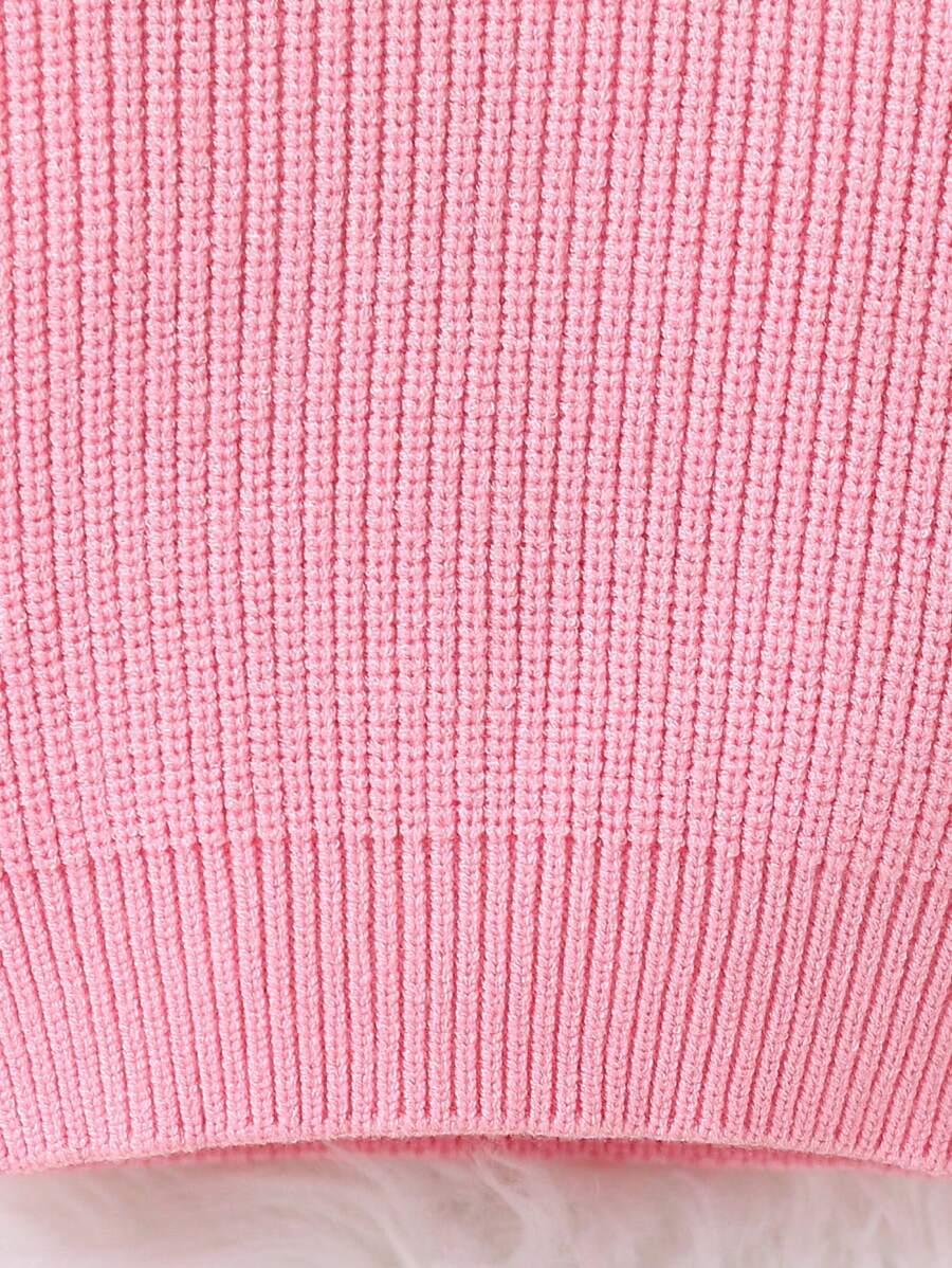 różowy sweter z golfem