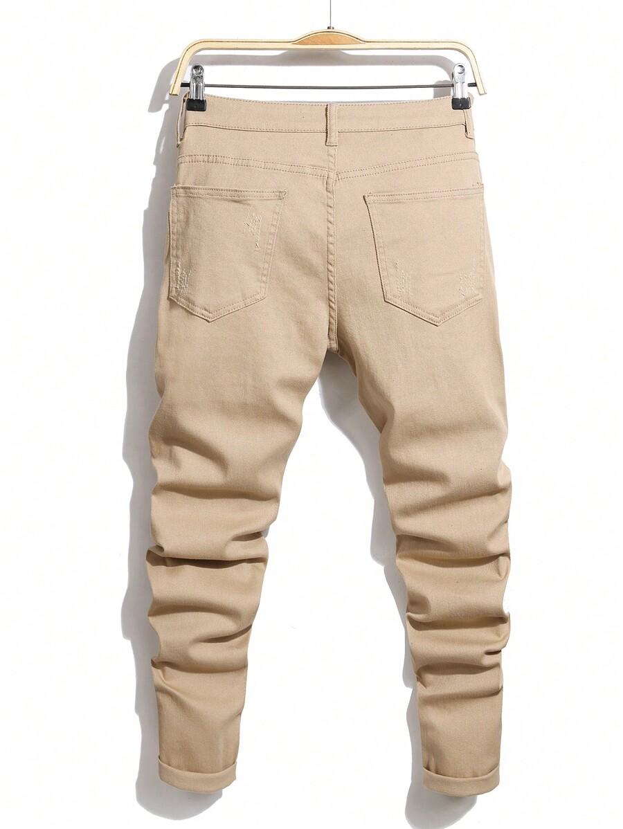 BEŻOWE SPODNIE JEANS PRZETARCIA