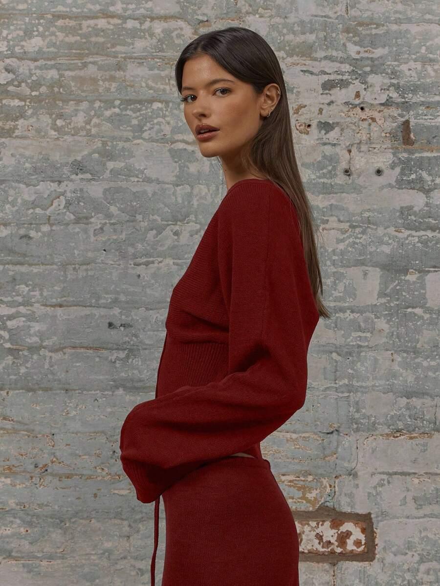 czerwony sweter guziki