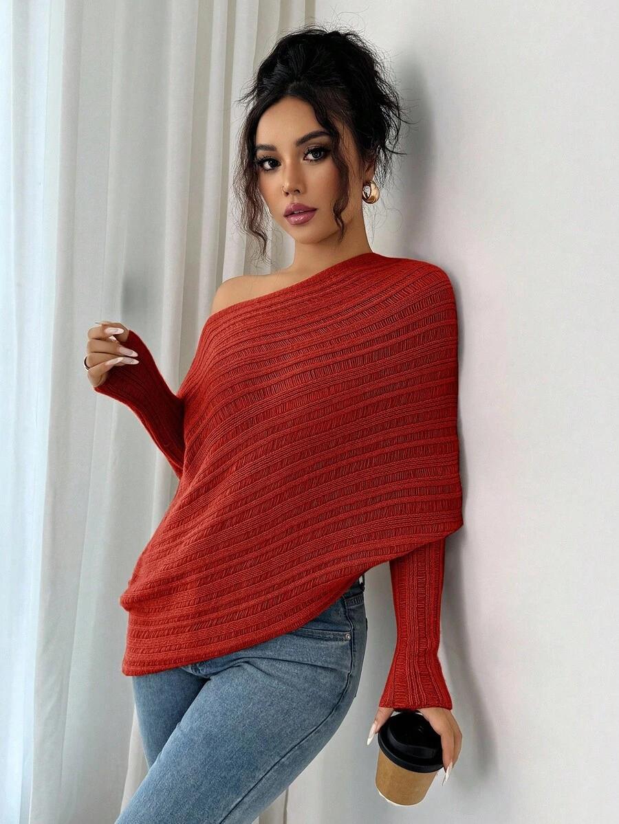 pomarańczowy sweter asymetryczne dekolt