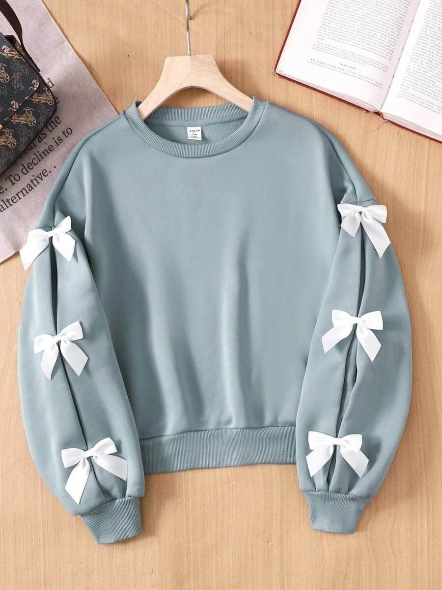 BLUZA DZIECIĘCA Z KOKADTKAMI NA RĘKAWACH