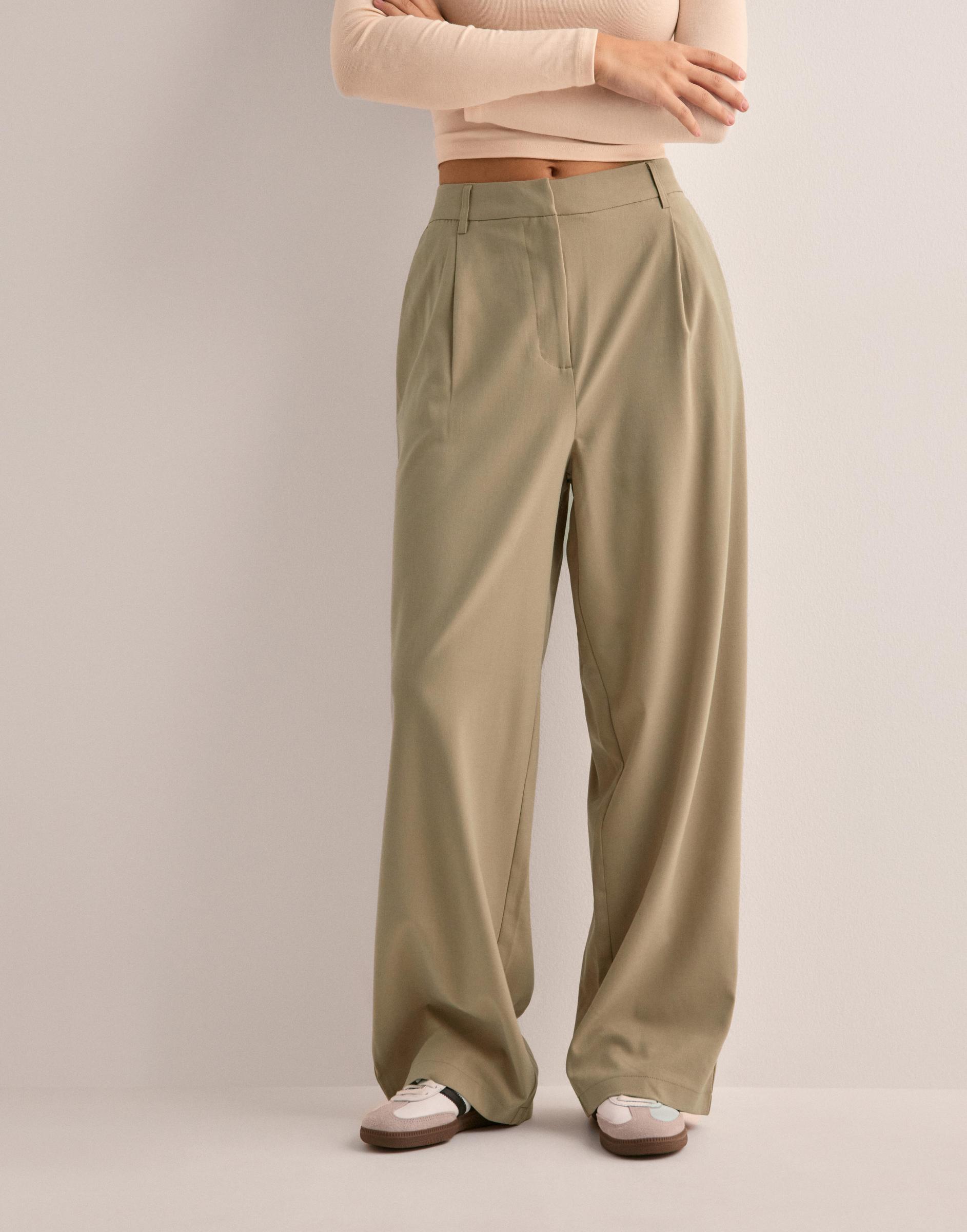 beżowe spodnie baggy kieszenie casual zamek
