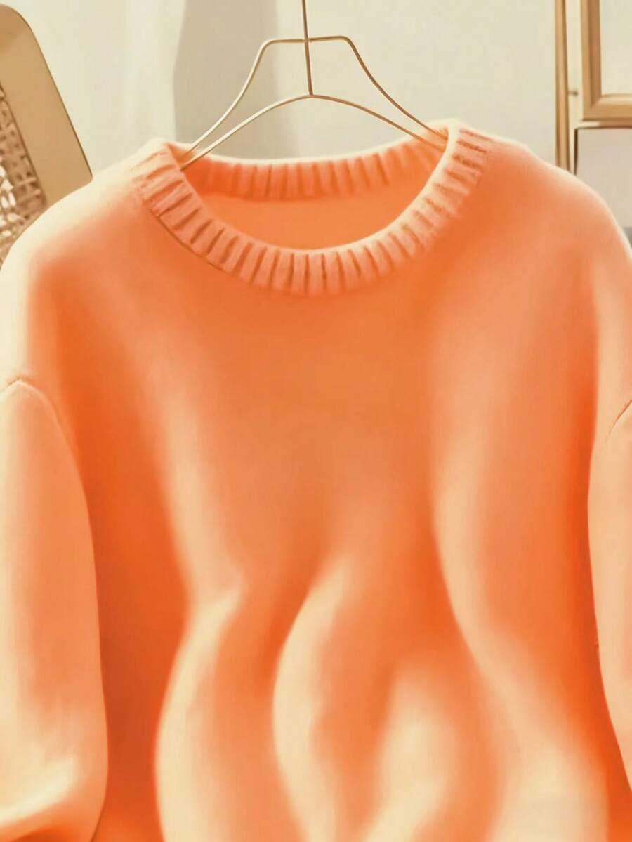 pomarańczowy dzianinowy sweter