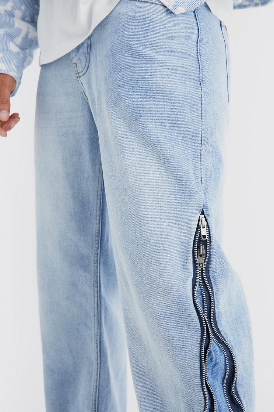 niebieskie spodnie jeans guziki kieszenie zamki