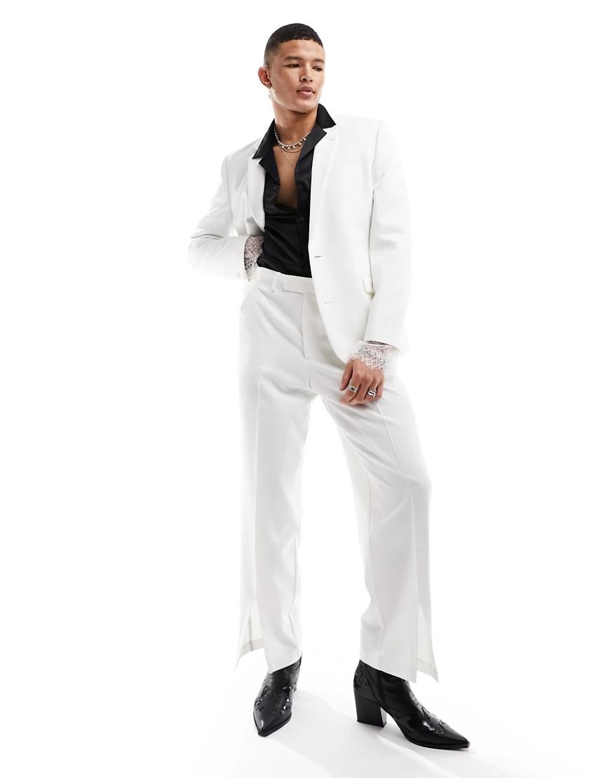 białe eleganckie spodnie z rozcięciem