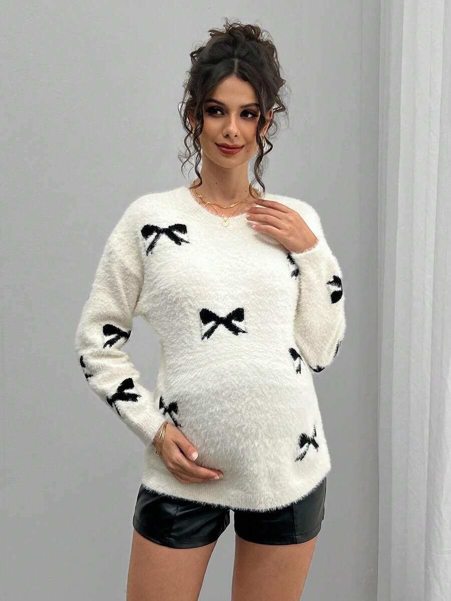 biały sweter ciążowy