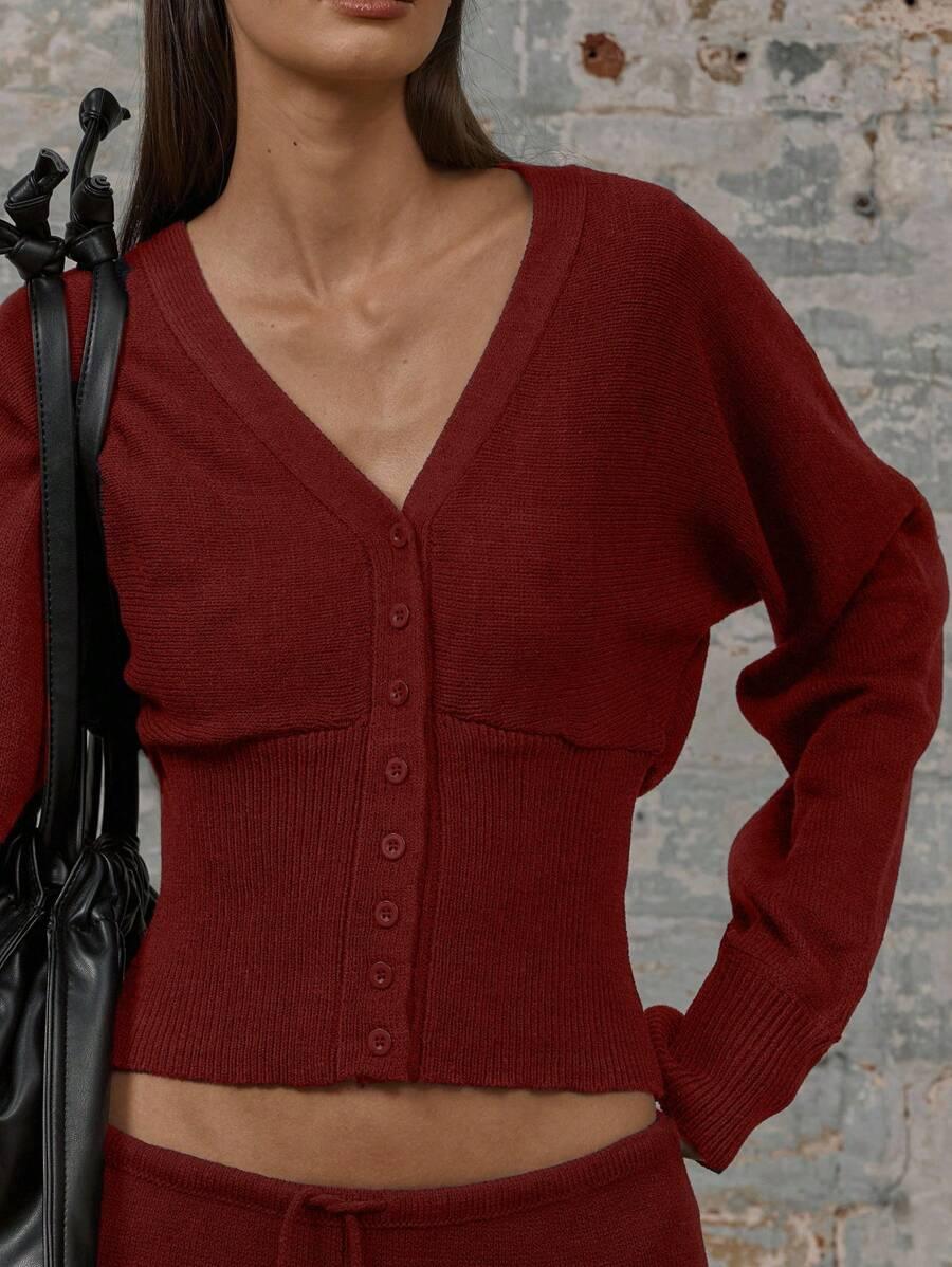 czerwony sweter guziki