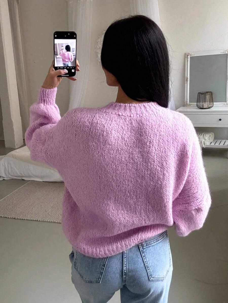 klasyczny luźny różowy sweter
