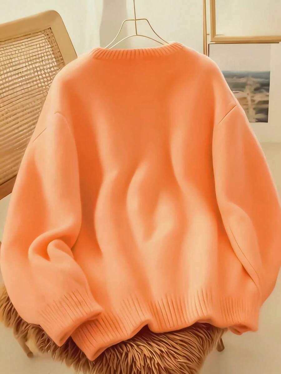 pomarańczowy dzianinowy sweter