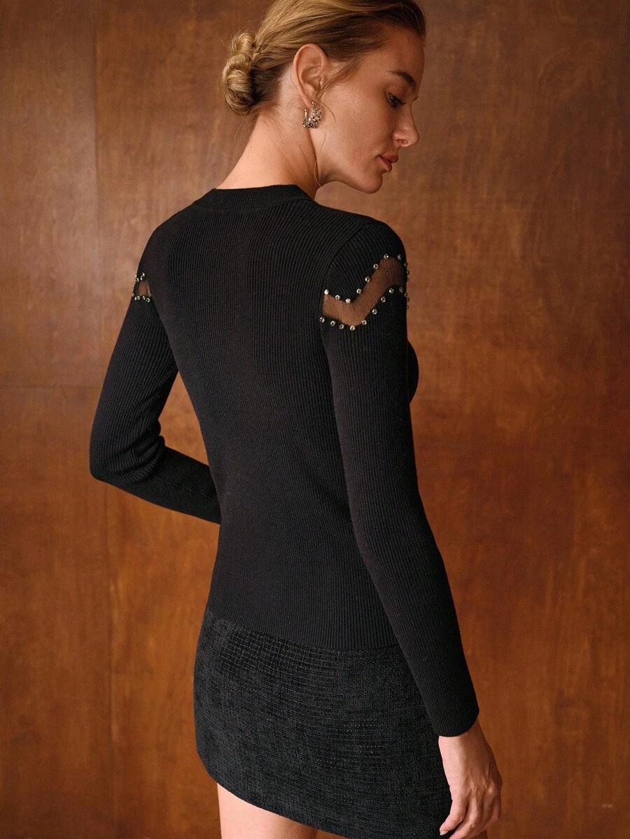 czarny sweter zdobienia