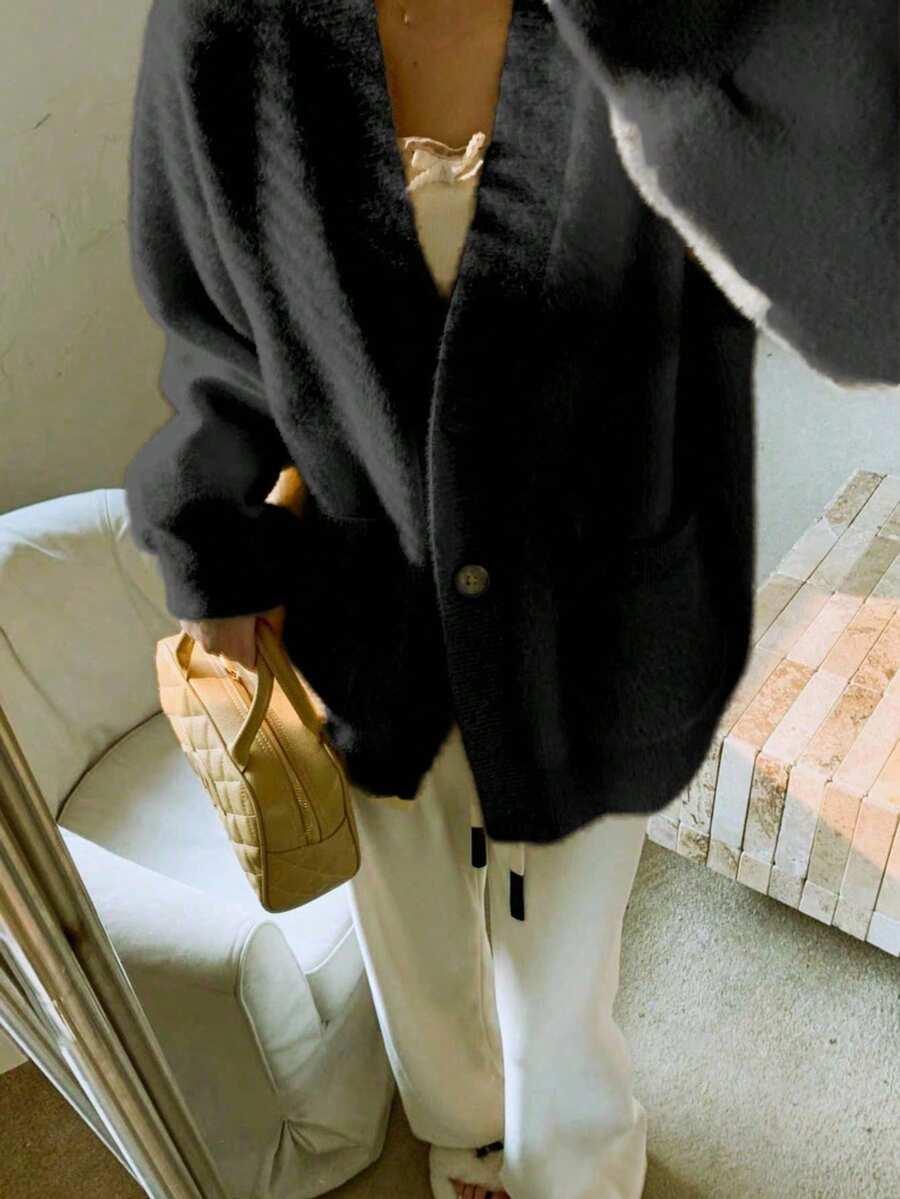 CZARNY SWETER GUZIKI