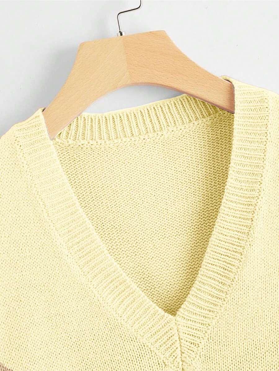 żółty sweter bez rękawów v-neck