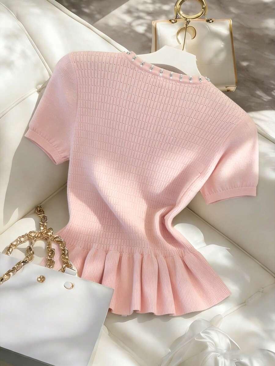 różowy dzianinowy sweter