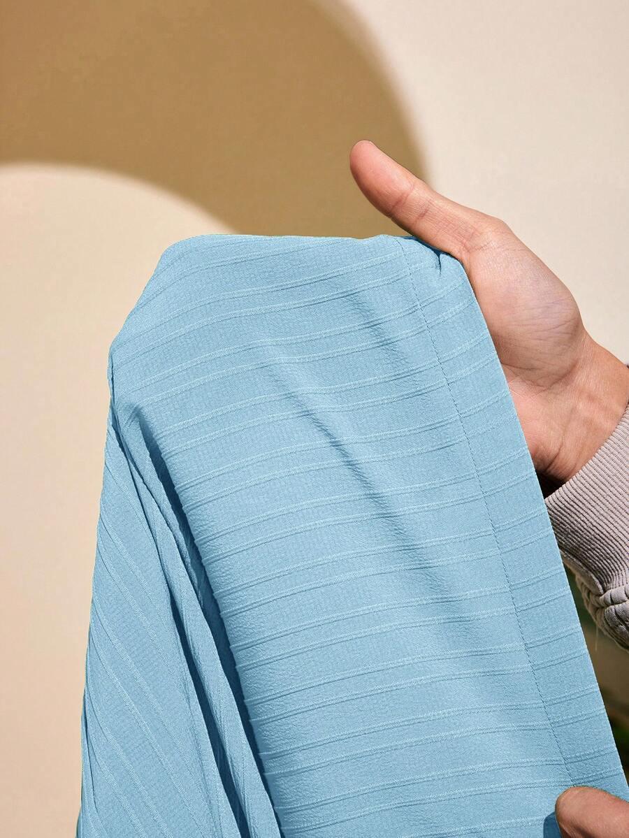 kremowe spodnie wide leg tekstura wysoki stan