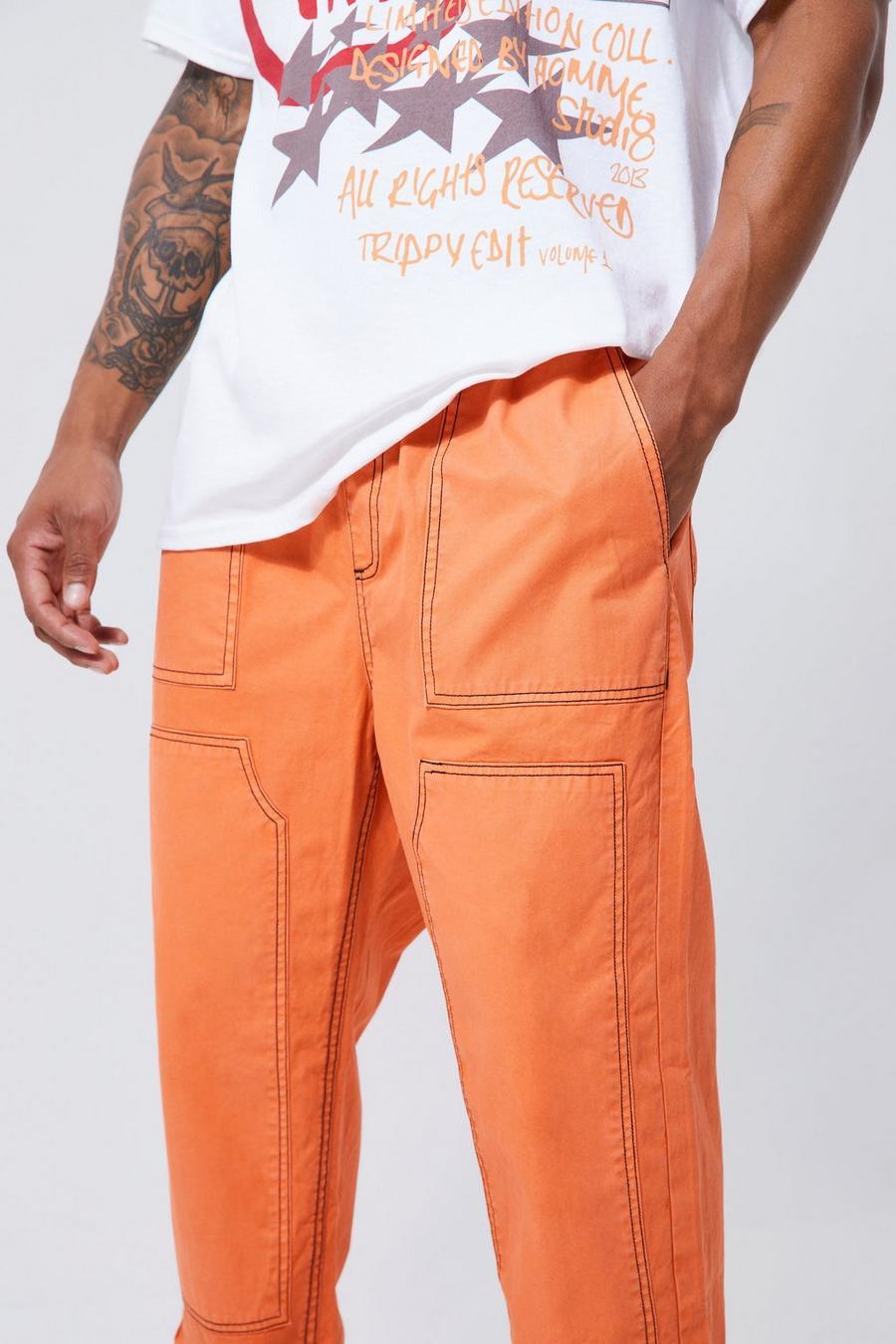 pomarańczowe spodnie kontrastowe szwy casual