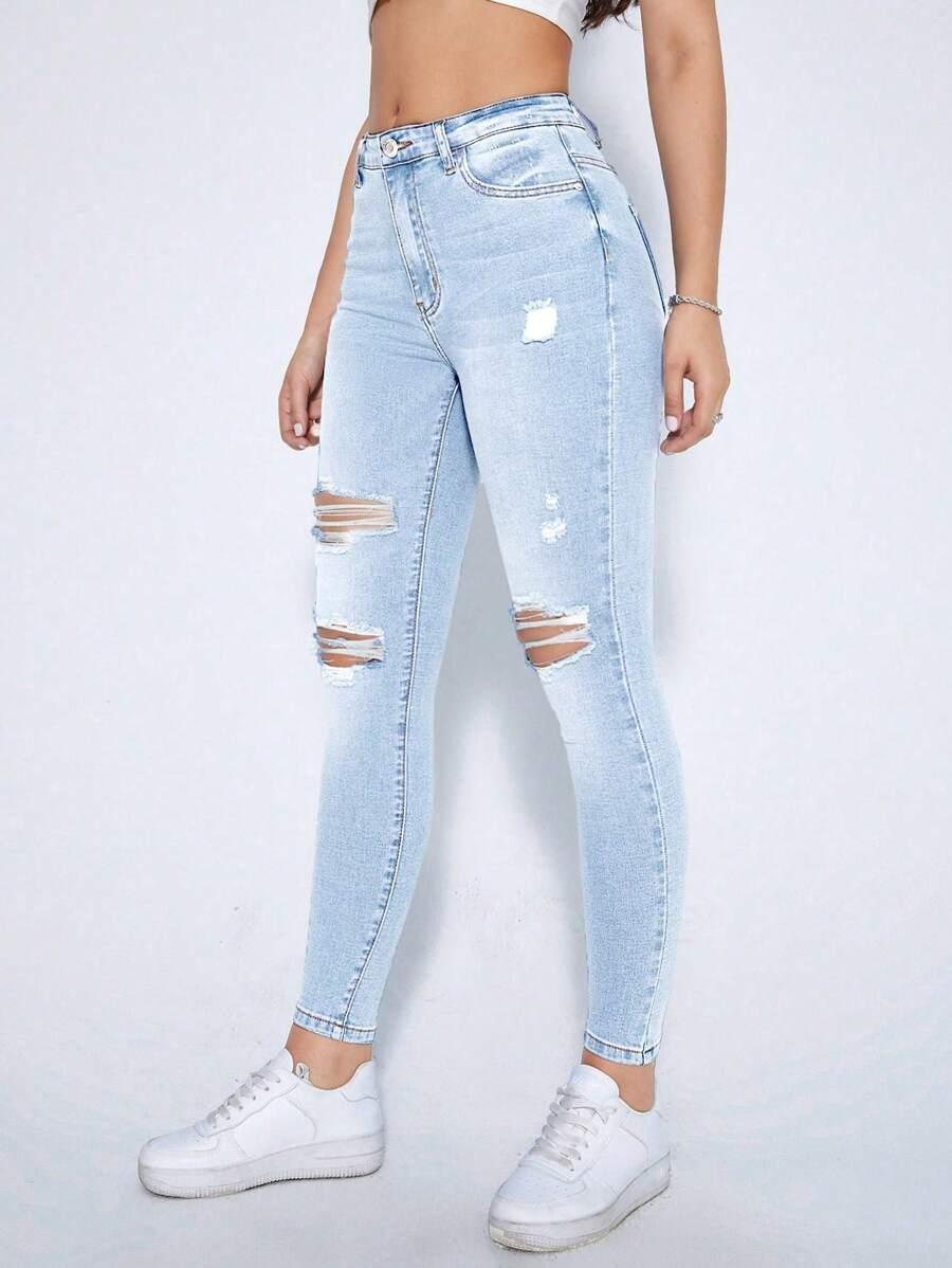 niebieskie spodnie jeans przetarcia