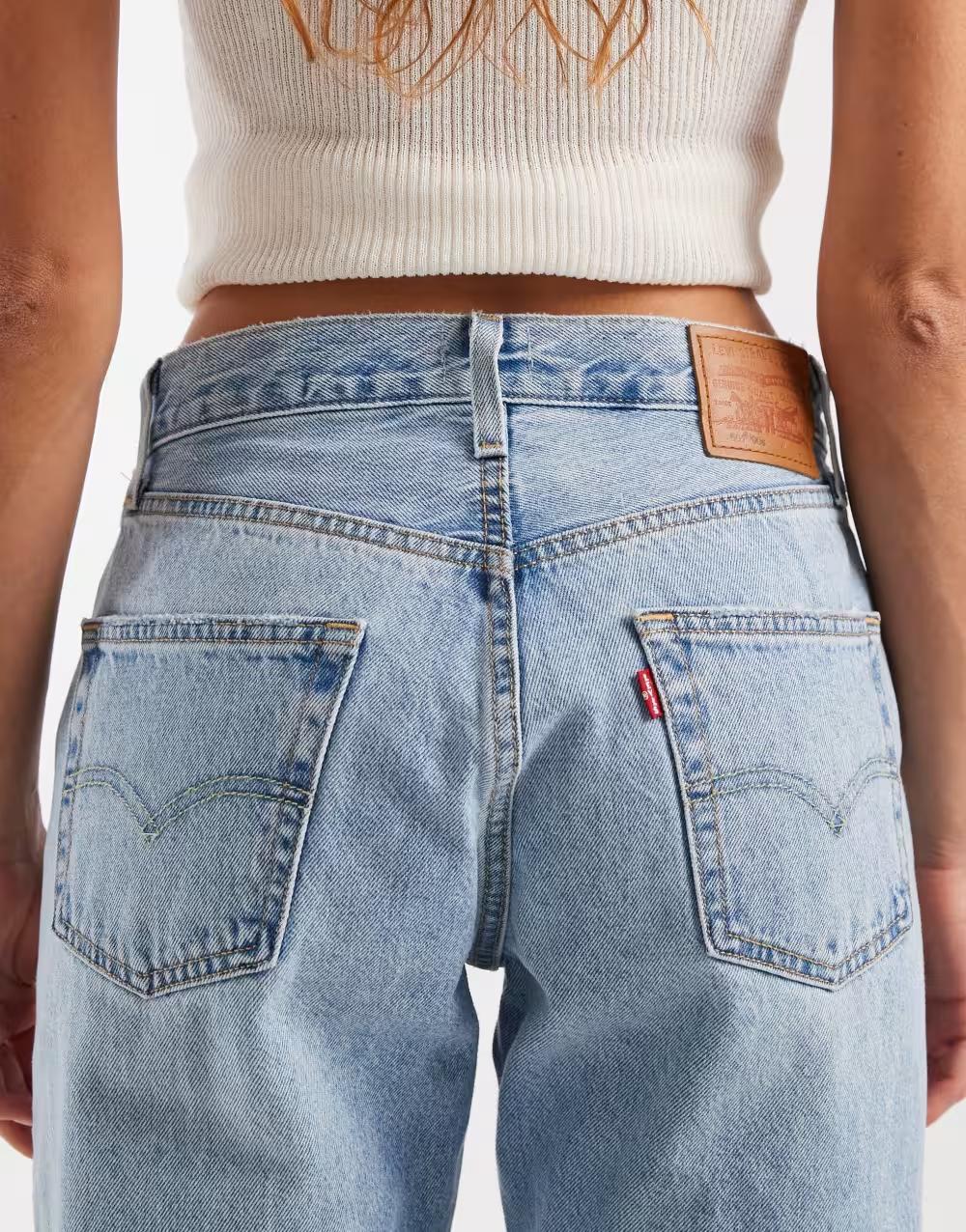 niebieskie  spodnie jeans logo