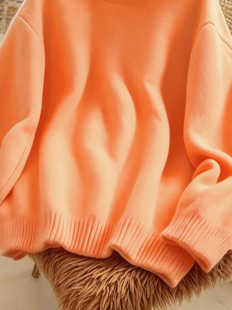 pomarańczowy dzianinowy sweter