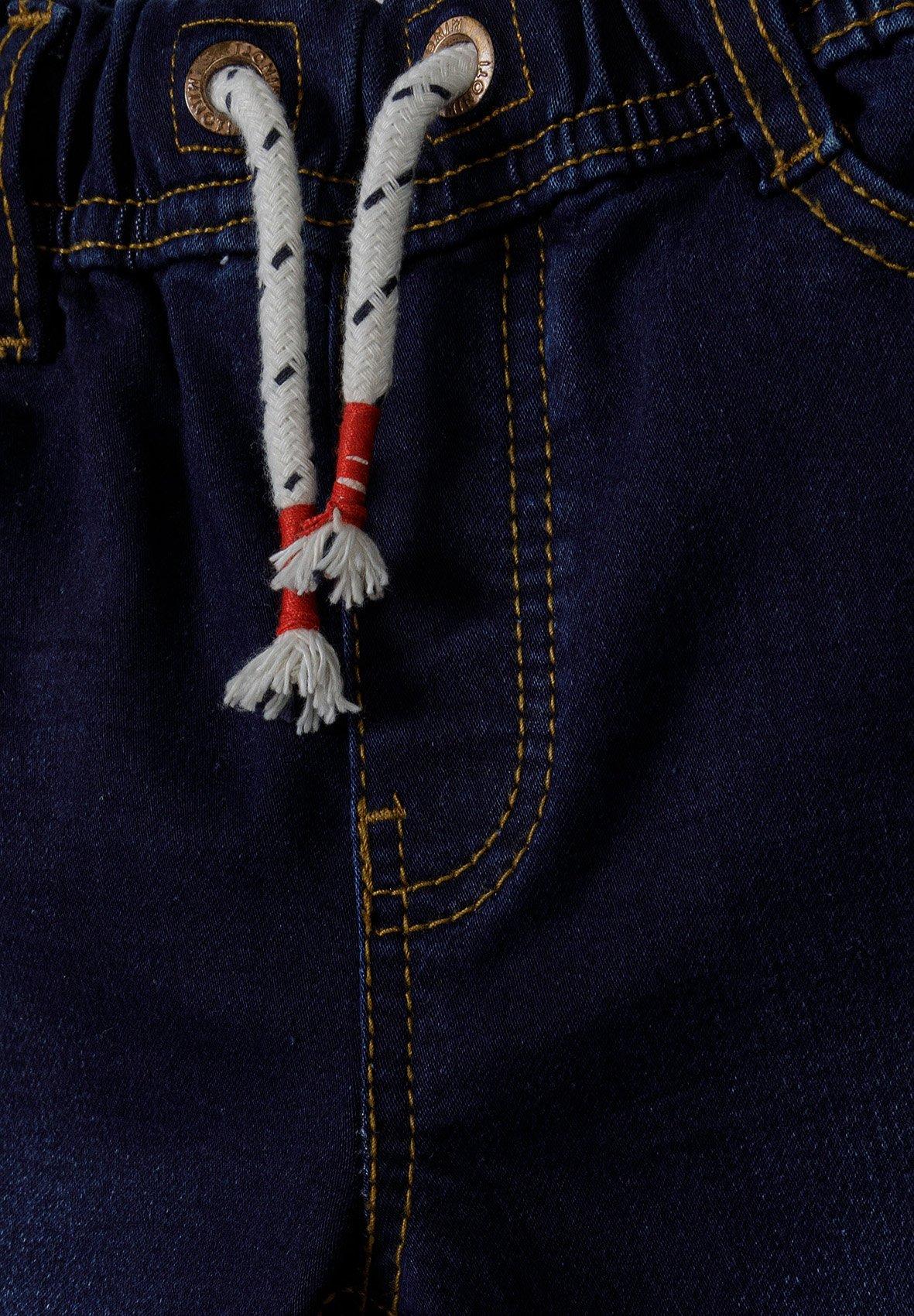 przecierane spodnie rurki jeans na gumce