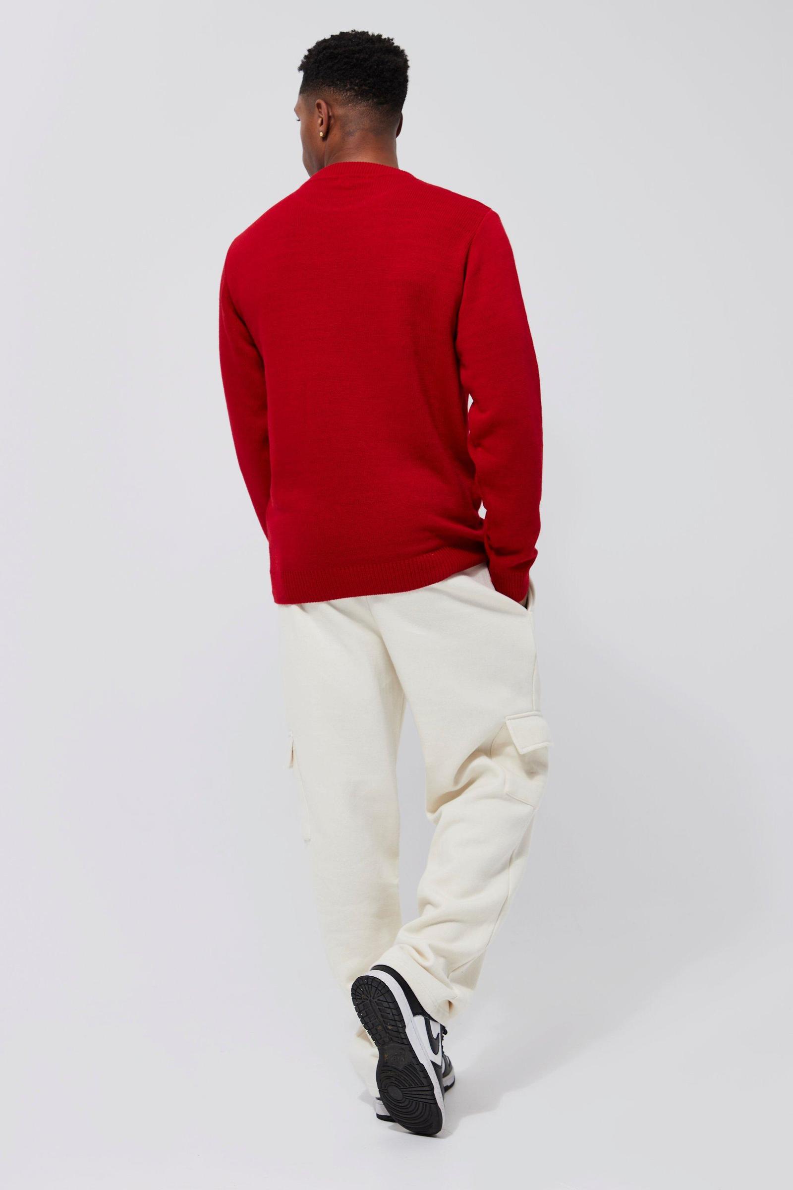 czerwony dzianinowy sweter wzór