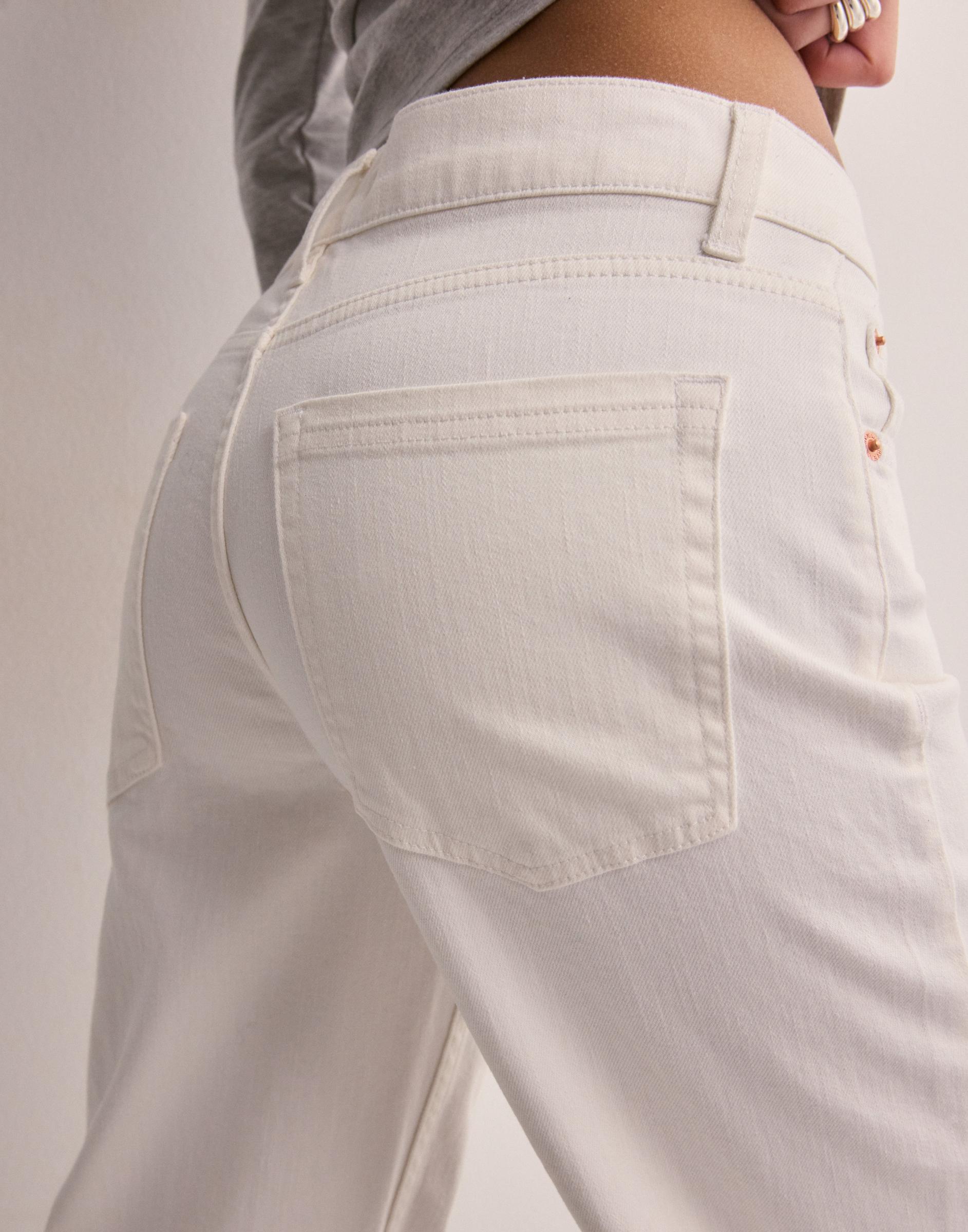 rozszerzane białe spodnie jeans mid waist